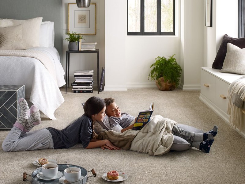 kids reading on soft beige carpet from Anderson Flooring Centre, Inc. in Winnipeg, MB