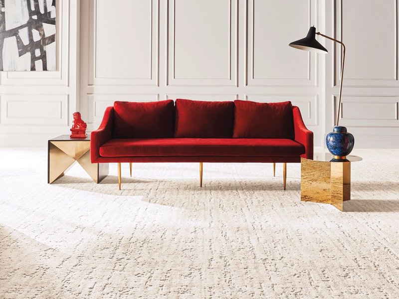 red sofa on beige carpet from Anderson Flooring Centre, Inc. in Winnipeg, MB